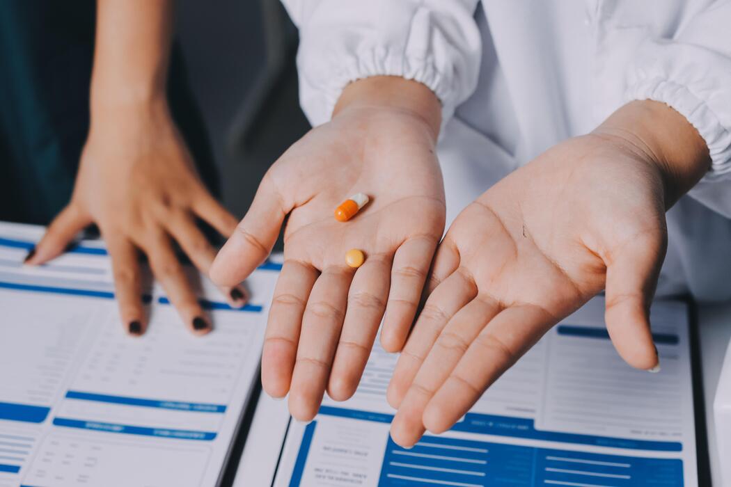 What is the strongest natural pain reliever - A doctor holding pills and papers