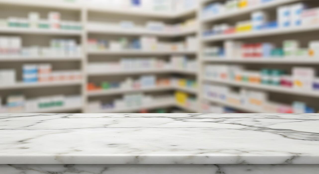 viagra pills for men - Marble counter top in pharmacy store with blurred background