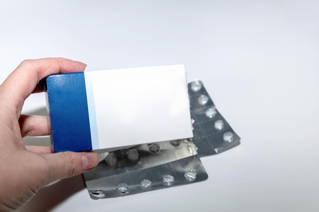 viagra pills online - White and blue medicine package mockup with blisters.