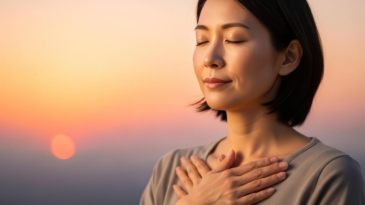 How to fall asleep in 10 seconds - Asian woman with closed eyes and hands on chest at sunset