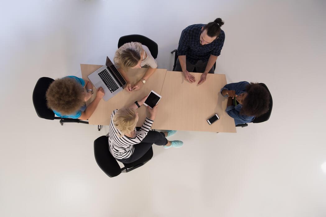 small business website design agency - Multiethnic startup business team on meeting  top view