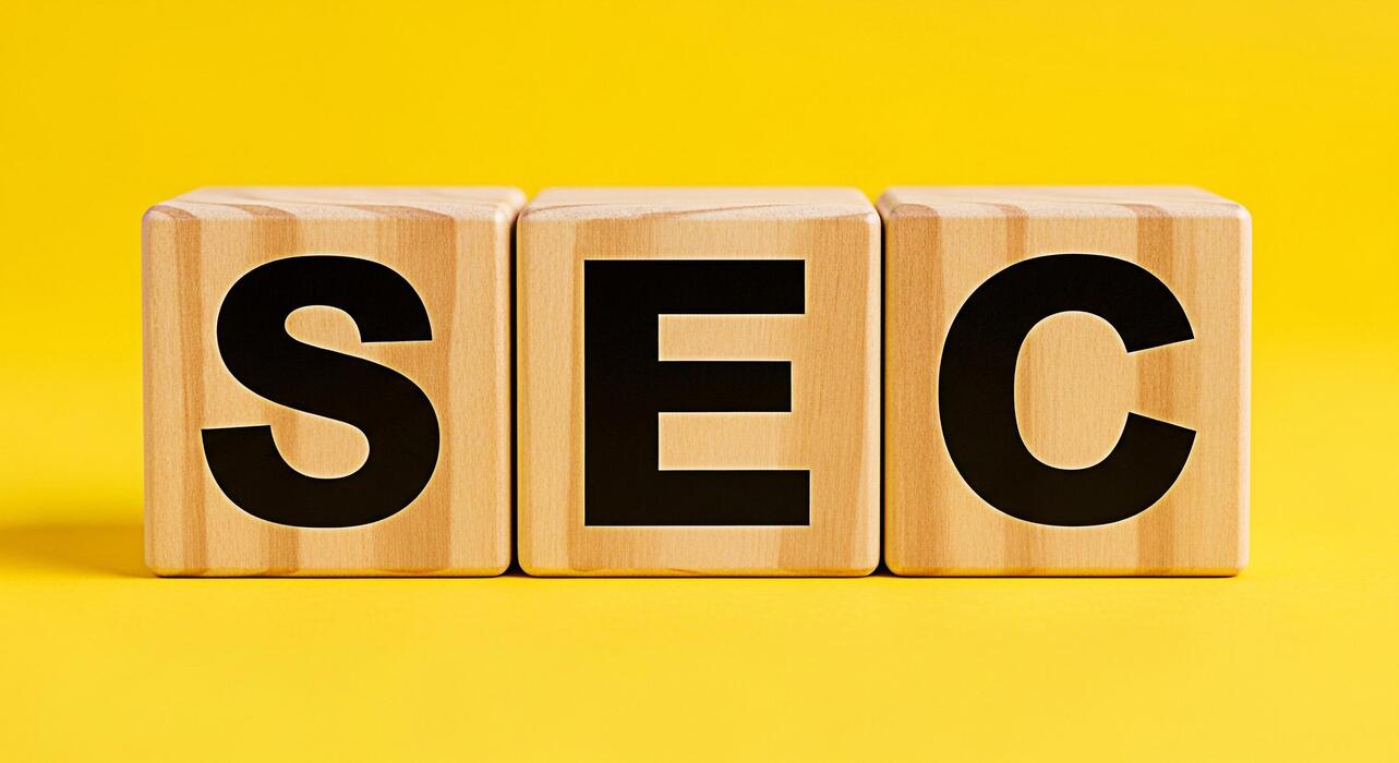 seo basics for small businesses uk - Wooden blocks clearly displaying the acronym SEC symbolizing financial regulation and investment oversight on a vibrant yellow background conveying authority and compliance