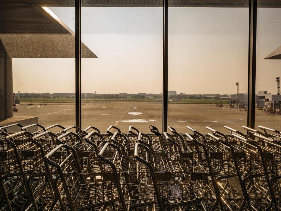 Superkings cigarettes duty free - Luggage Cart beside the window in don muang internation airport bangkok City Thailand