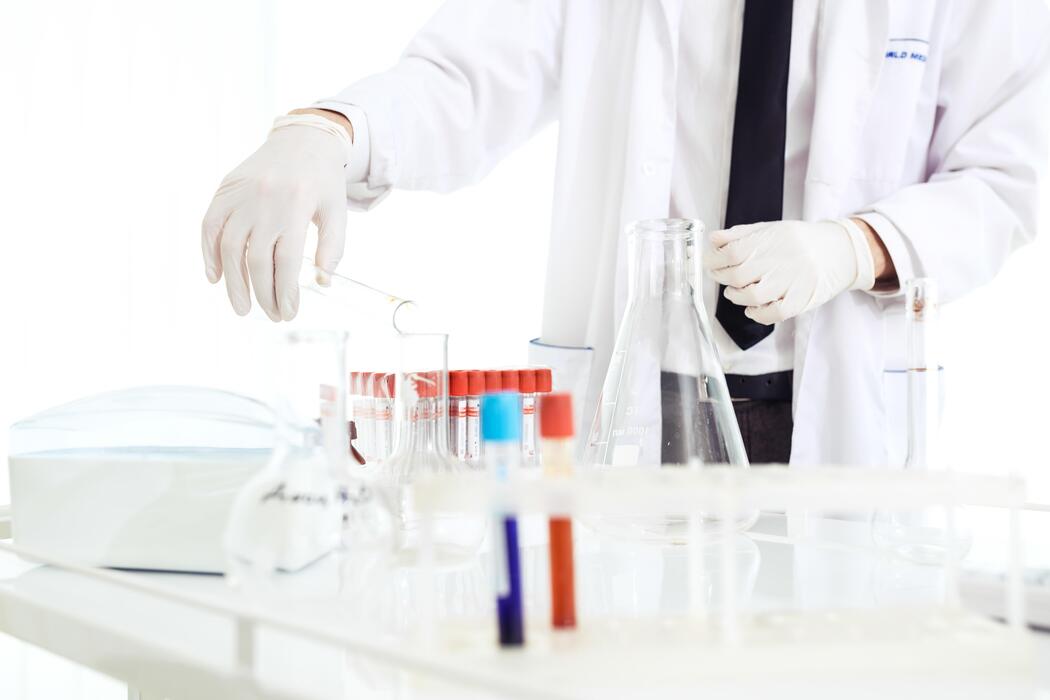 Cheapest research peptides - team of researchers collaborating in the lab Scientific concept featuring a Caucasian male chemist.