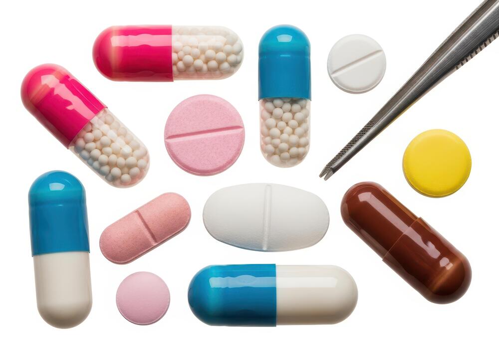 What are the negatives of taking peptides? - Assorted capsules and pills with tweezers