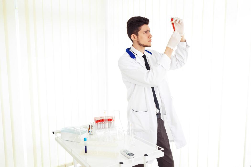 Where is the safest place to buy peptides? - team of researchers conducting experiments in the lab Laboratory theme featuring a Caucasian male chemist.
