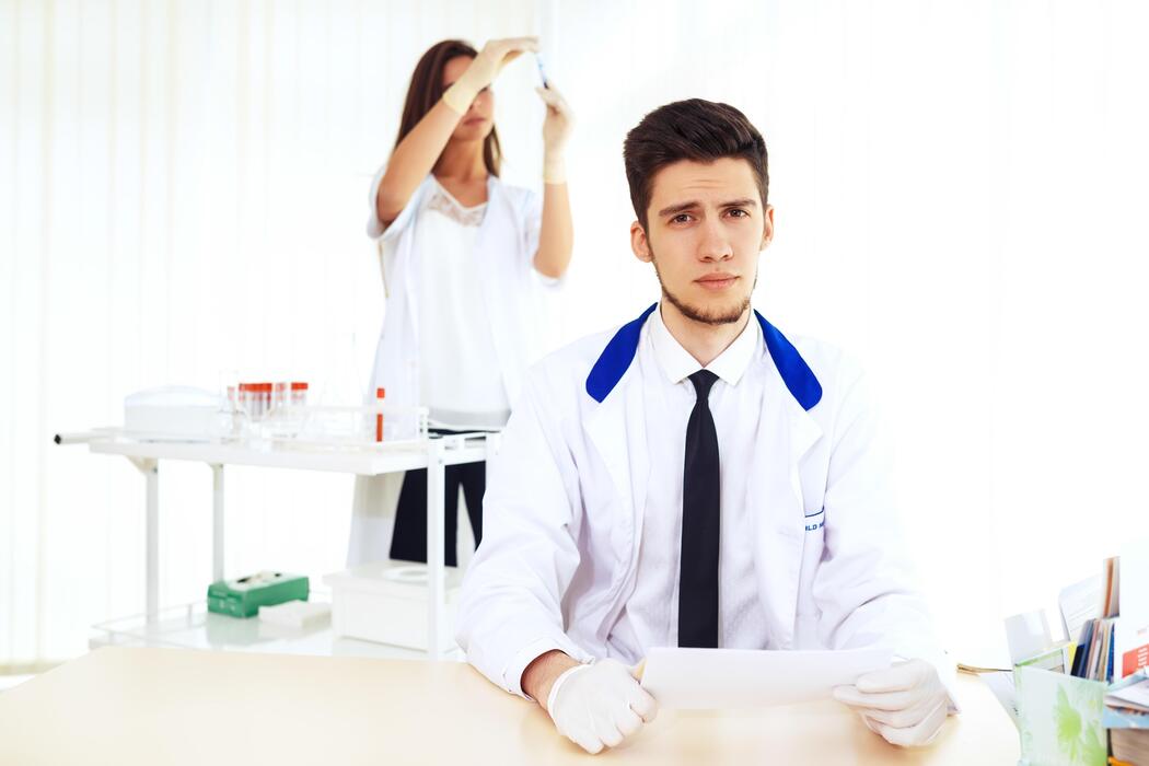 What is the best research peptide company? - team of researchers collaborating in the lab Laboratory theme featuring a Caucasian male chemist.