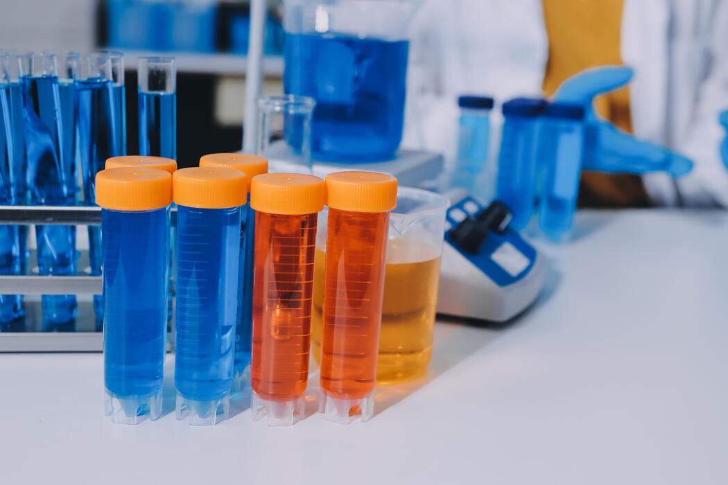 Research peptides for sale - A laboratory with test tubes and a person in a lab coat